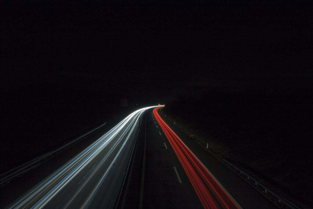 time lapse photography of cars on road during night time