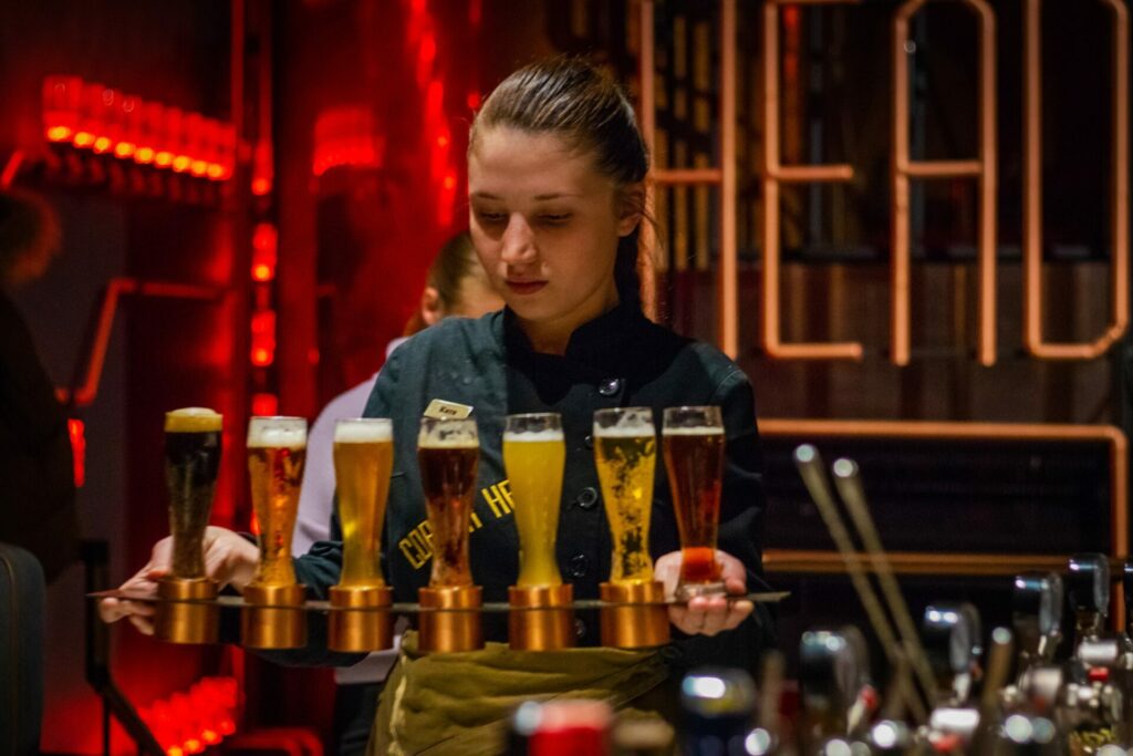 woman rack of carrying glasses of liquors