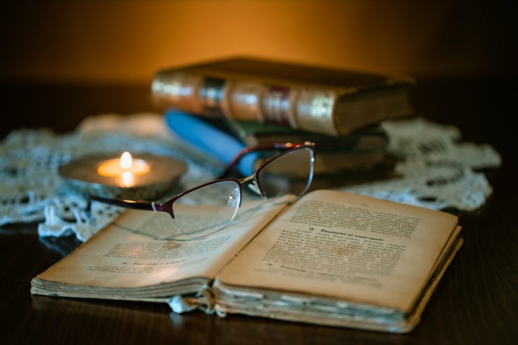 black framed eyeglasses on book page